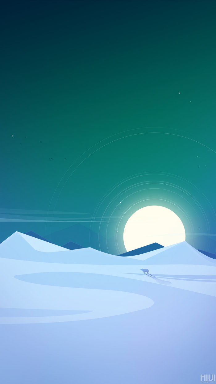 Polar bear in a snowy landscape under a bright moon