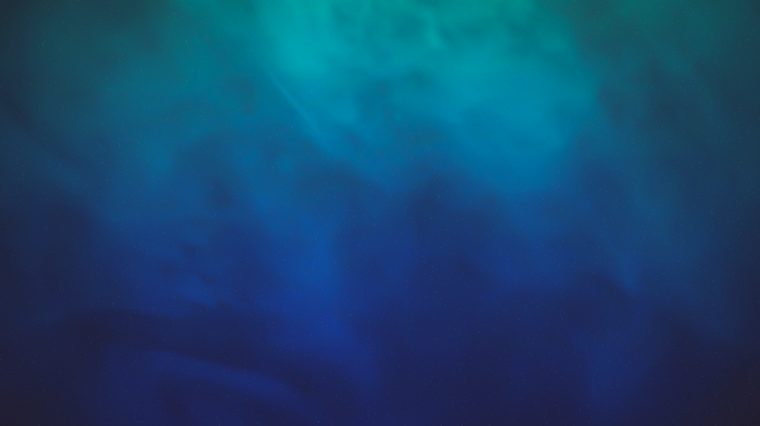 Blue and teal abstract nebula with stars