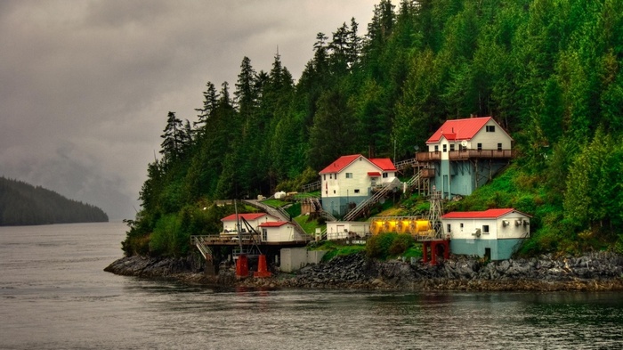 Buildings on a forested coast in British Columbia, Canada