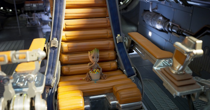 Baby Groot from Guardians of the Galaxy eating candy