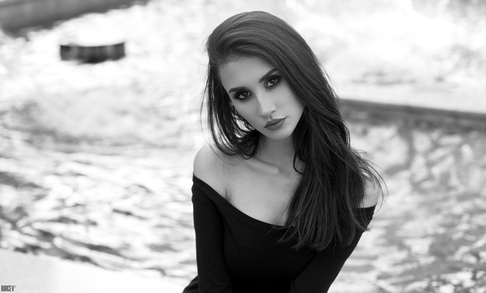 Monochrome portrait of a woman with dark hair