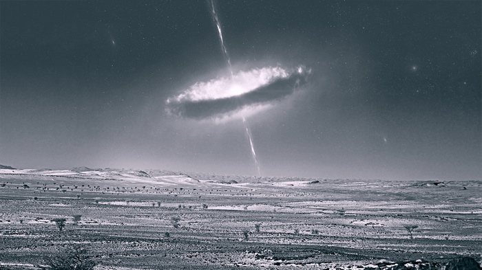 Black hole with jets over a desert landscape