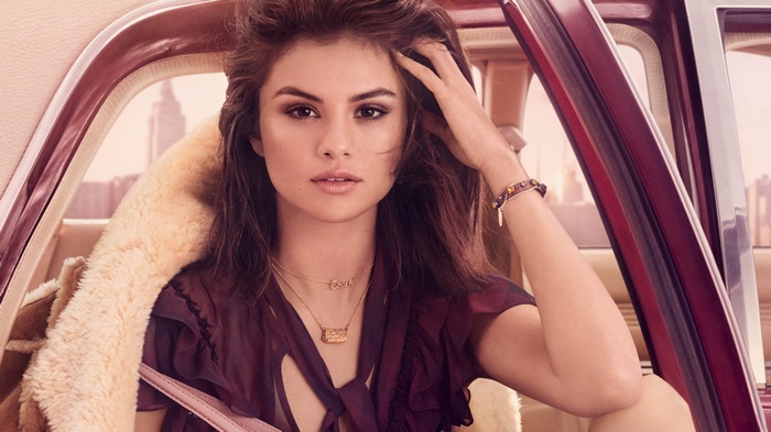 Selena Gomez in a car