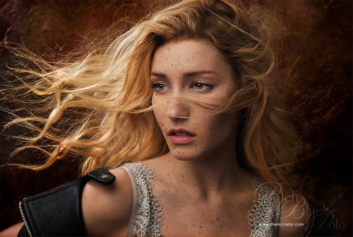 Portrait of a woman with freckles and blonde hair