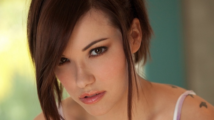 Elizabeth Marxs with a tattoo and lipstick