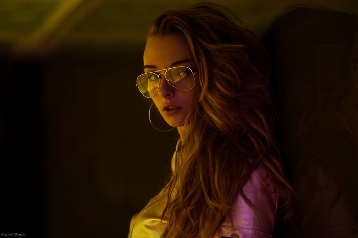Woman with blonde hair and glasses