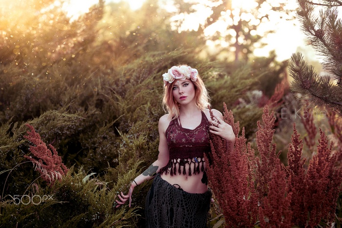 Woman with flower crown in nature