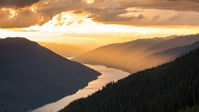 Sunrise over a mountain valley with a river