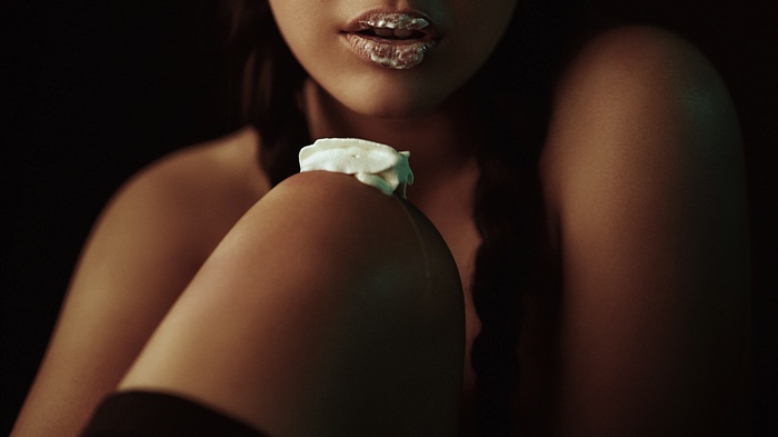 Woman with whipped cream on lips and knee