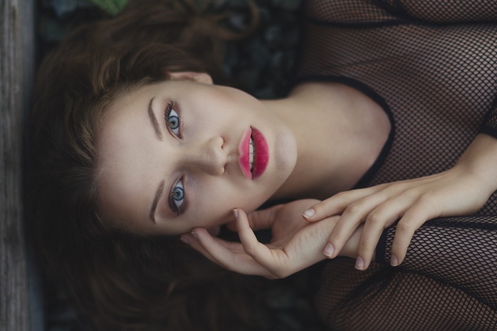 Woman with blue eyes and red lipstick