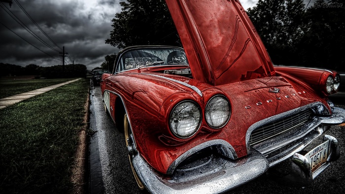 Red 1961 Chevrolet Corvette with hood open