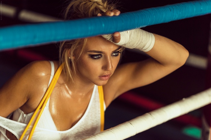 Woman boxer leaning on ring ropes, David Ben Haïm