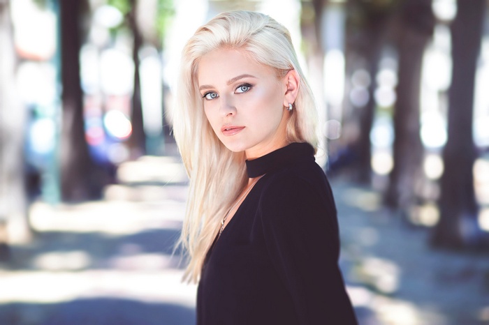 Woman with blonde hair outdoors