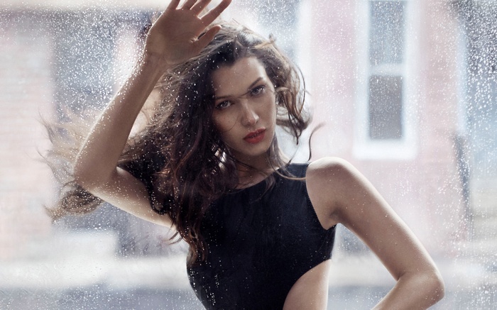 Bella Hadid in black swimsuit with water drops