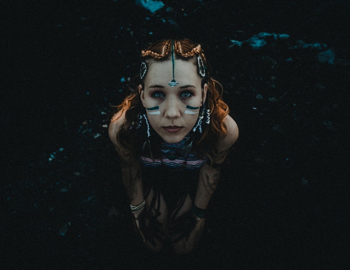 Woman with face paint and braids