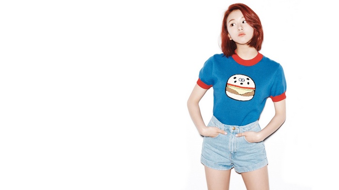 Korean woman with red hair wearing a blue t-shirt