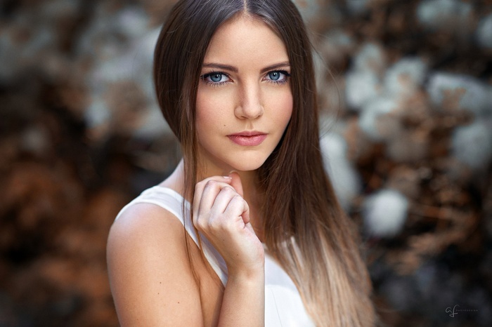 Woman with blue eyes and long brown hair