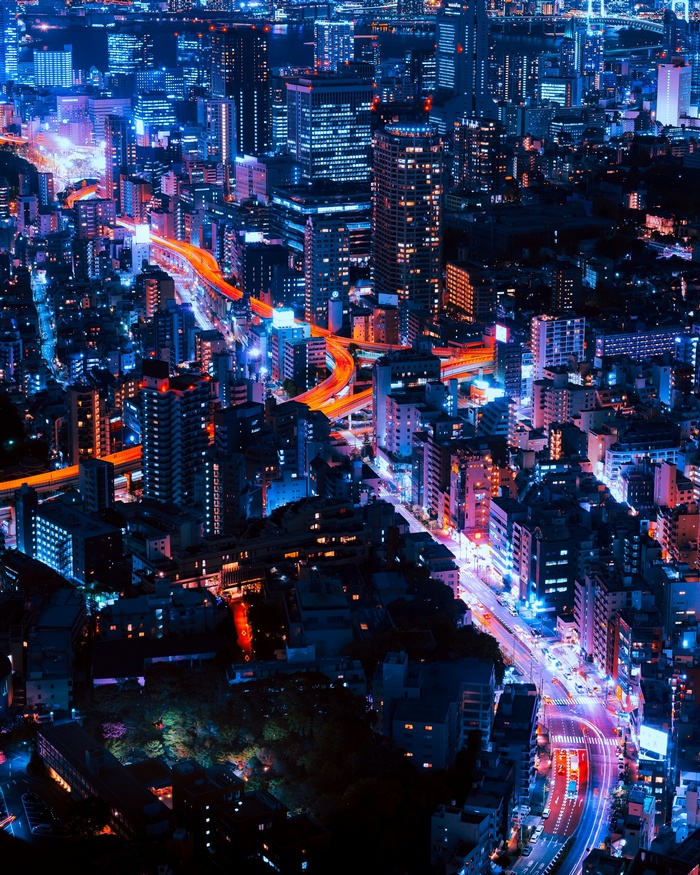Aerial view of Tokyo at night with illuminated highways