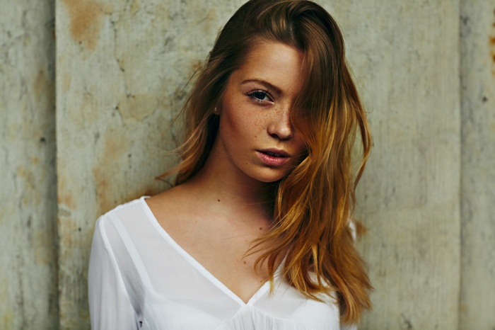 Woman with freckles and wavy hair
