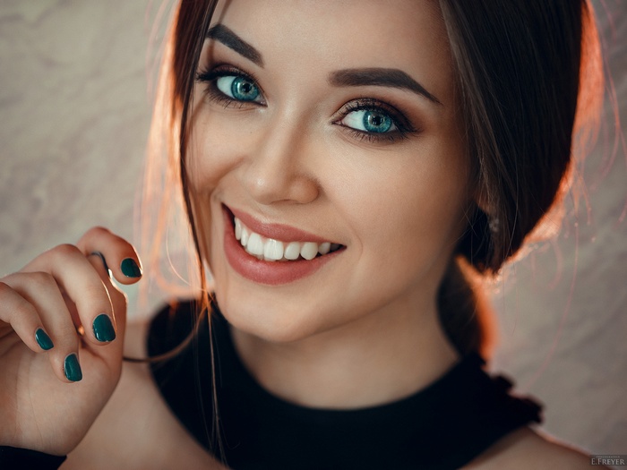 Portrait of a woman with blue eyes and dark hair