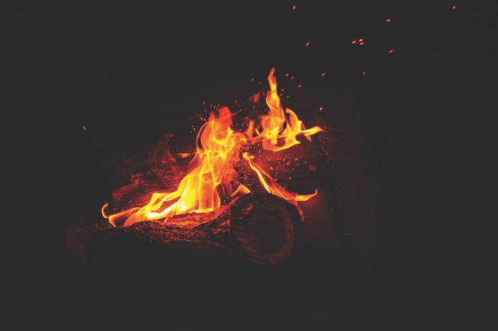Campfire with burning logs and sparks