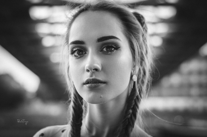 Monochrome portrait of a woman with pigtails