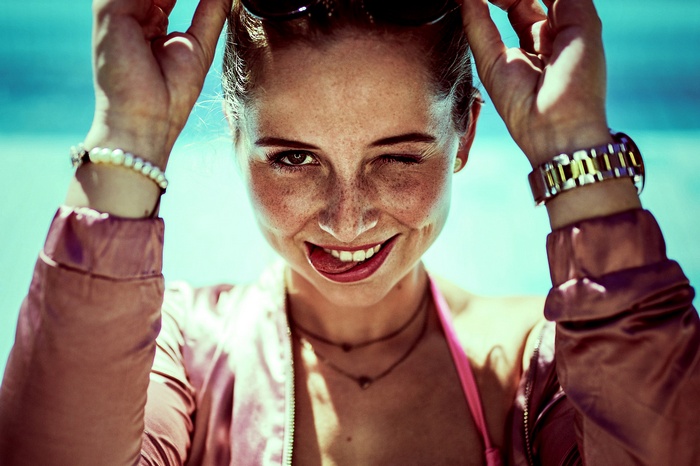 Woman winking and sticking her tongue out