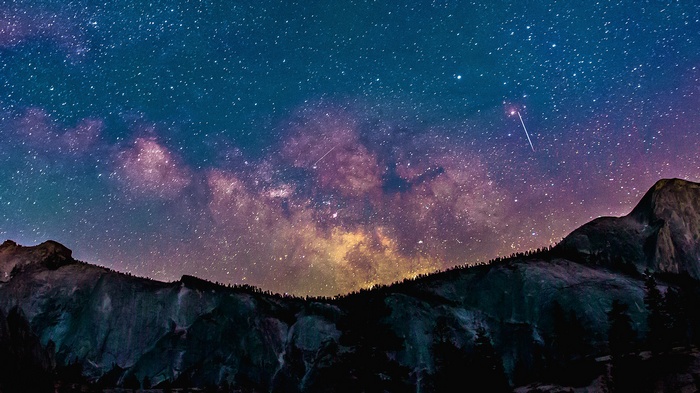 Milky Way galaxy over mountains at night