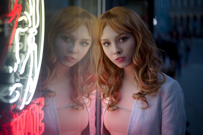 Alice Tarasenko reflected in neon lights