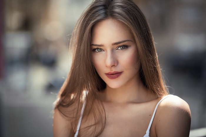 Portrait of a young woman with long brown hair