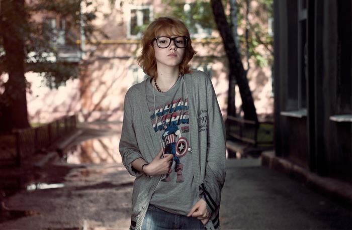 Woman with glasses wearing Captain America t-shirt