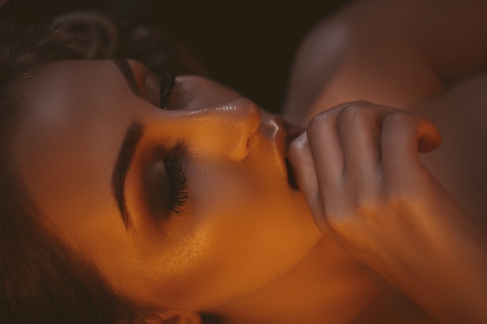 Close-up portrait of a woman with closed eyes