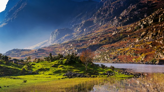 Mountain landscape with a lake and green hills