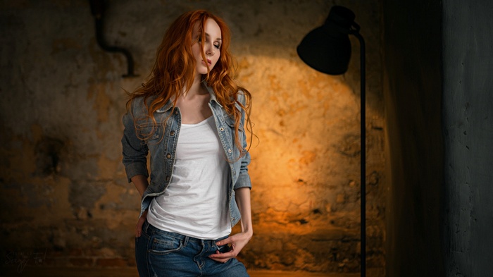 Redhead woman in denim jacket and jeans