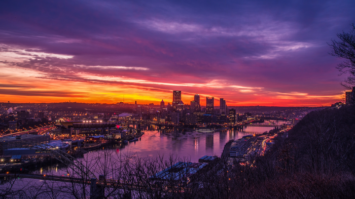 Pittsburgh cityscape at sunset with river