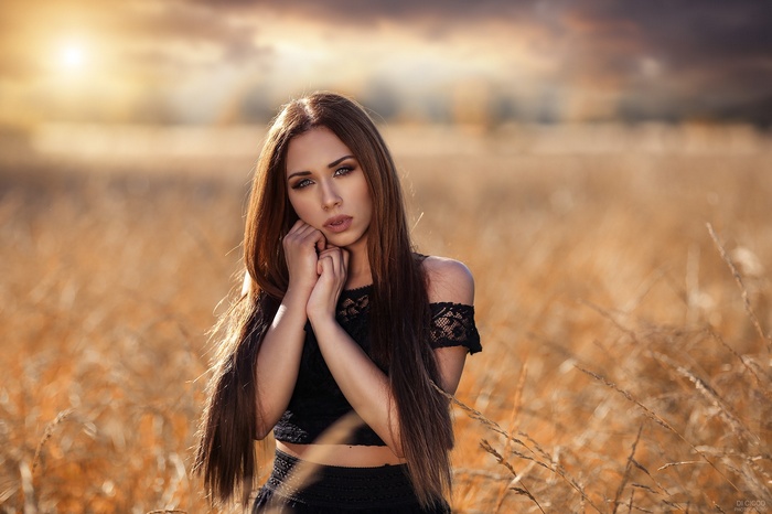 Woman with long hair in a field