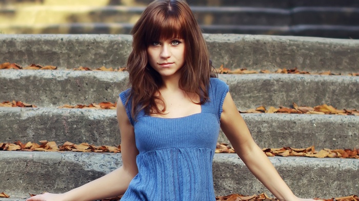 Katya Chekhova sitting on outdoor stairs