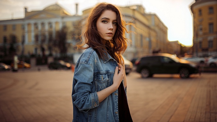Ksenia Kokoreva in a denim jacket outdoors