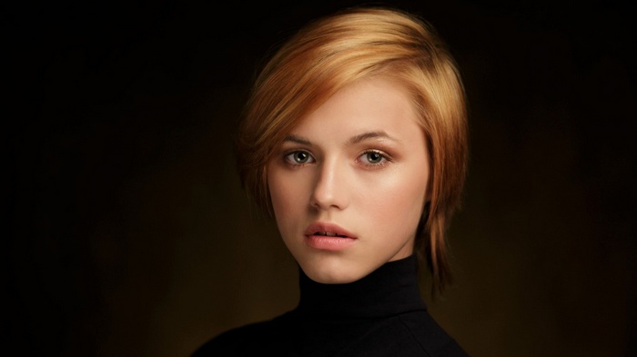 Portrait of a young woman with auburn hair
