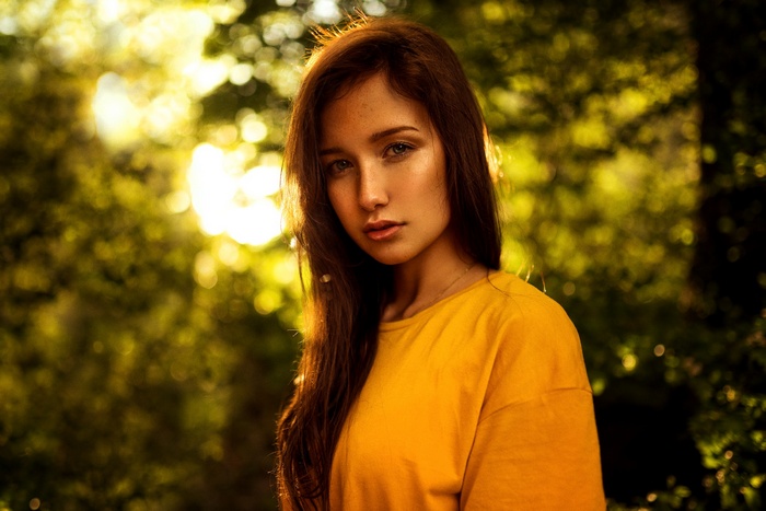 Portrait of a young woman with freckles