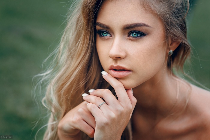 Woman with blonde hair and blue eyes