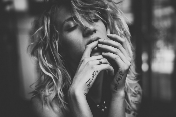 Monochrome portrait of Natasha Legeyda with tattoos