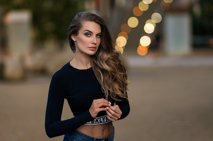 Lucie Syrohova portrait outdoors with bokeh lights