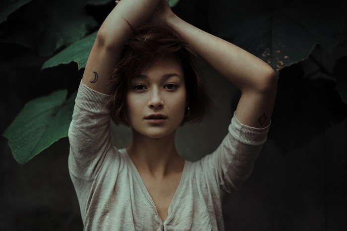 Woman with short hair and tattoos