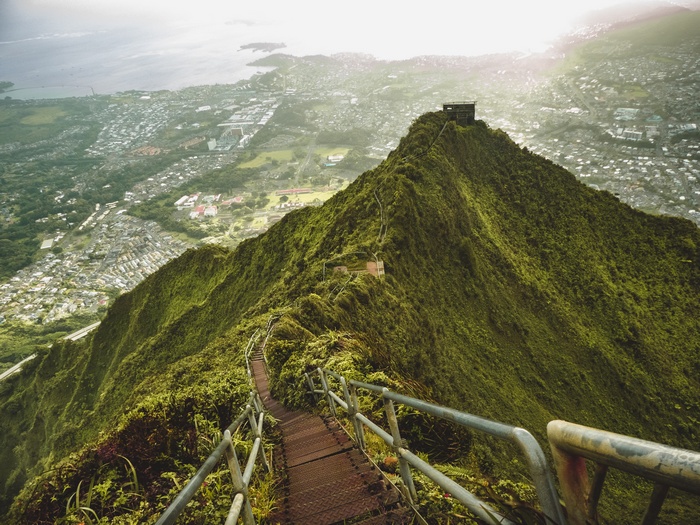 Stairway to Heaven hike on a green mountain overlooking a city