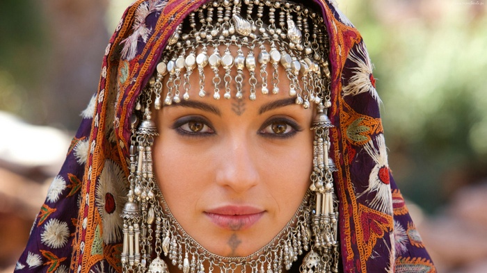 Woman wearing traditional headwear and jewelry