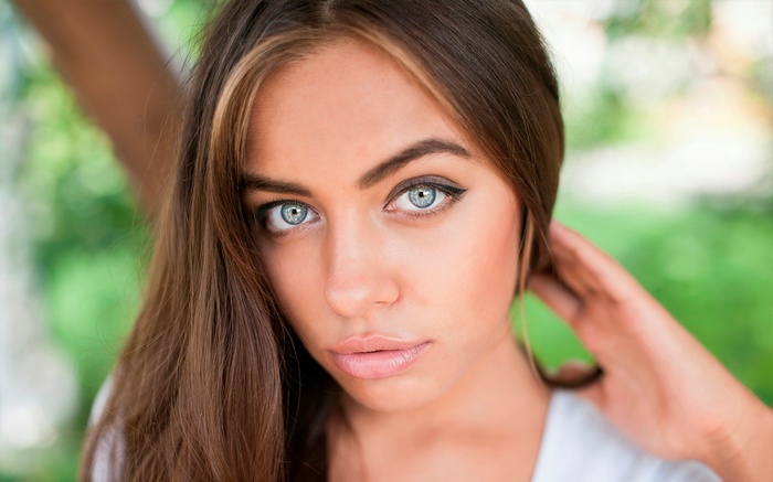 Woman with gray eyes outdoors