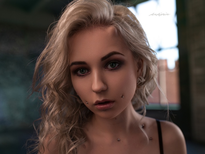 Woman with blonde hair and piercings