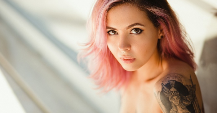 Woman with pink dyed hair and nose ring
