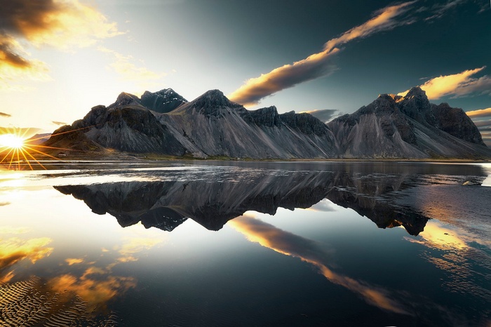 Mountains reflecting in a lake at sunset